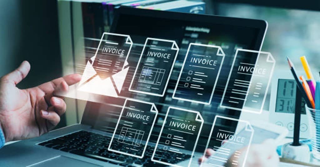 Hand interacting with floating digital invoice icons on a laptop screen for FBR compliance